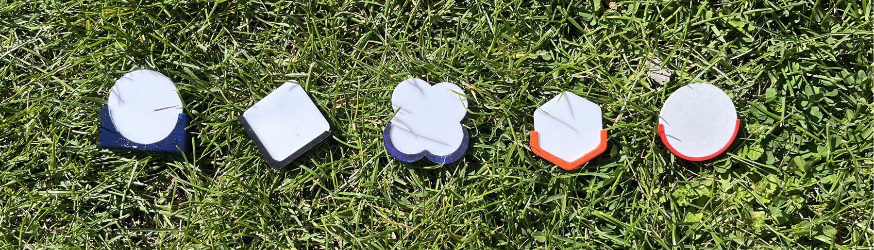 Tap & Know pin prototypes in different colors and shapes